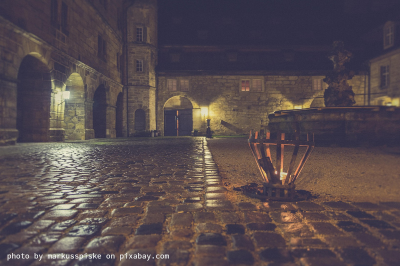 photo of a castle at night showing light sources